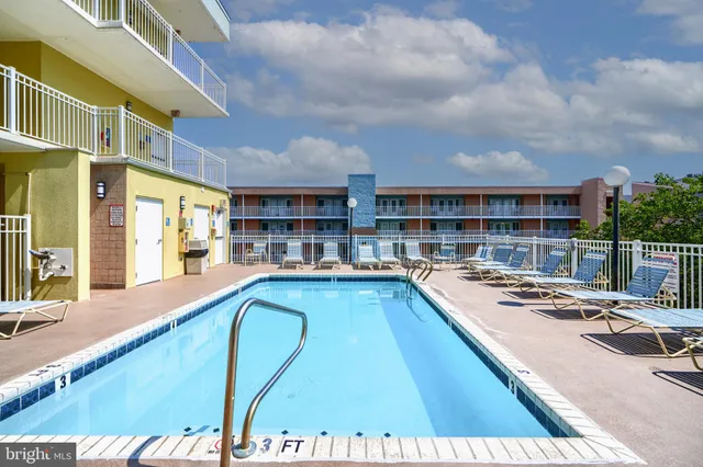 a kitchen with stainless steel appliances granite countertop a refrigerator sink and cabinets