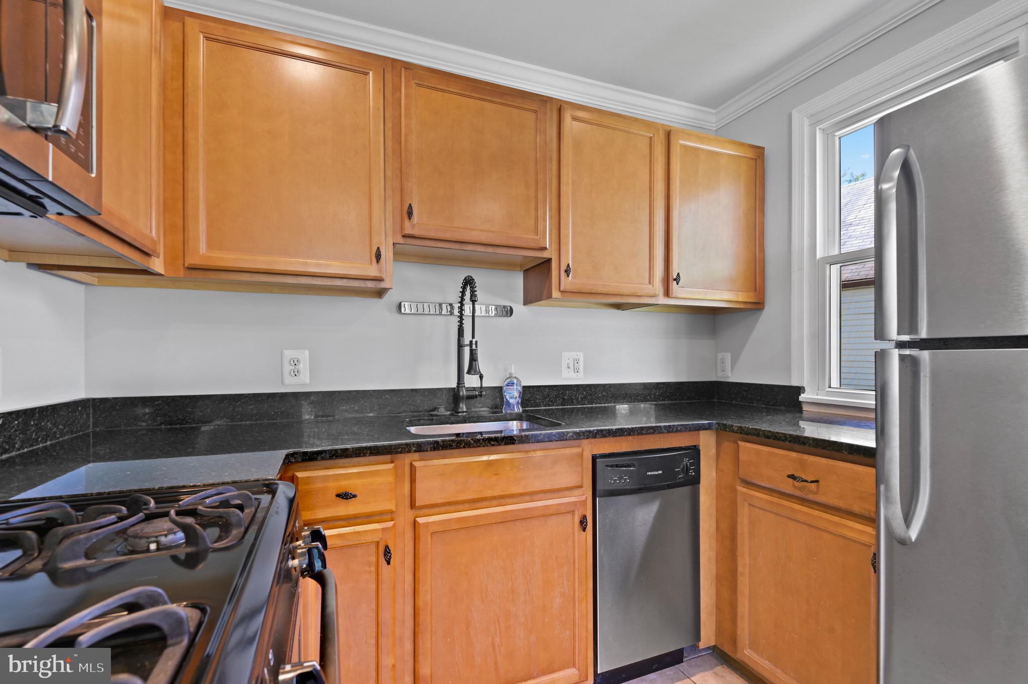 8111 Bullneck Road Baltimore, MD 21222 - Photo 5 of 26 Granite countertop, natural light, gas cooking