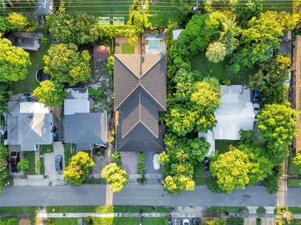 an aerial view of a house with a yard and garden