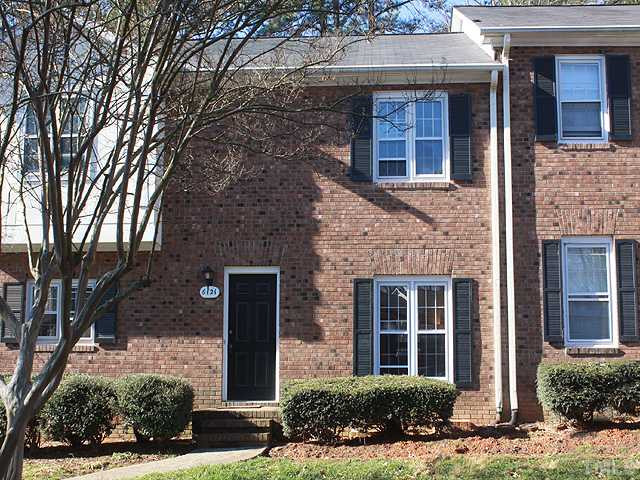 6121 Bushmills Street Raleigh, NC 27613 - Photo 13 of 13 All brick town home in NW Raleigh. 2 assigned parking space right in front of the property. Plus - plenty of visitor parking. Exterior Front