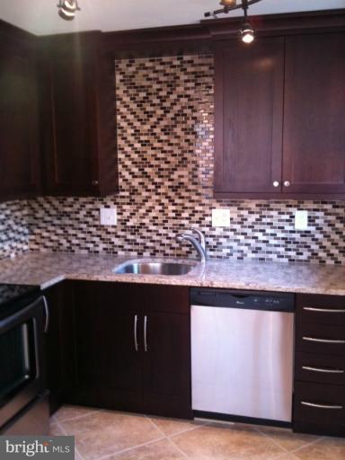 3903 Weller Road Silver Spring, MD 20906 - Photo 2 of 18 a view of wooden cabinets