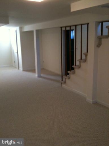 3903 Weller Road Silver Spring, MD 20906 - Photo 6 of 18 an empty room with closet and mirror