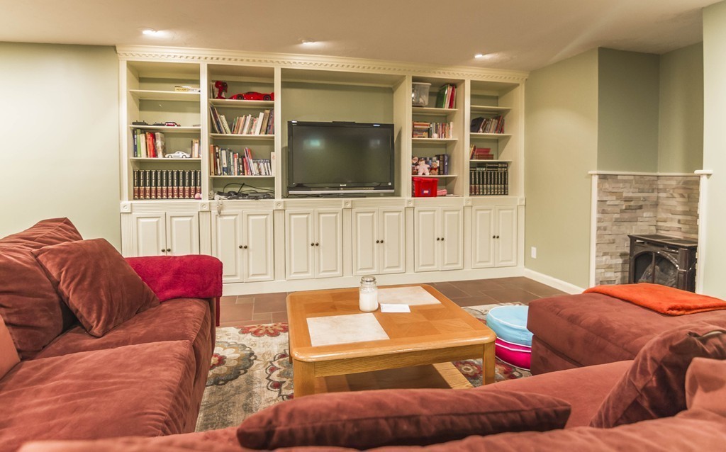 29 Tannery Road Sturbridge, MA 01518 - Photo 27 of 29 a living room with furniture cabinets and a flat screen tv