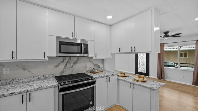 a kitchen with a stove and a microwave