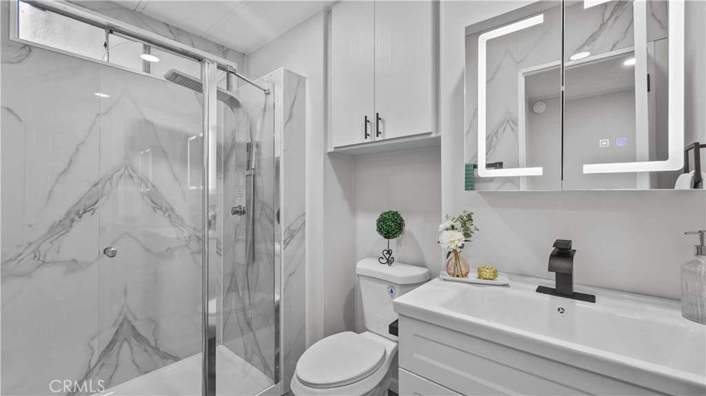 1400 13th Street, Unit 206 Upland, CA 91786 - Photo 19 of 28 a bathroom with a sink toilet and shower