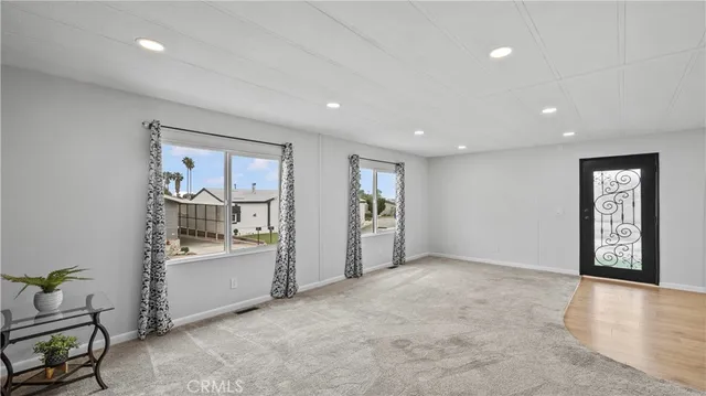 a view of an empty room and window