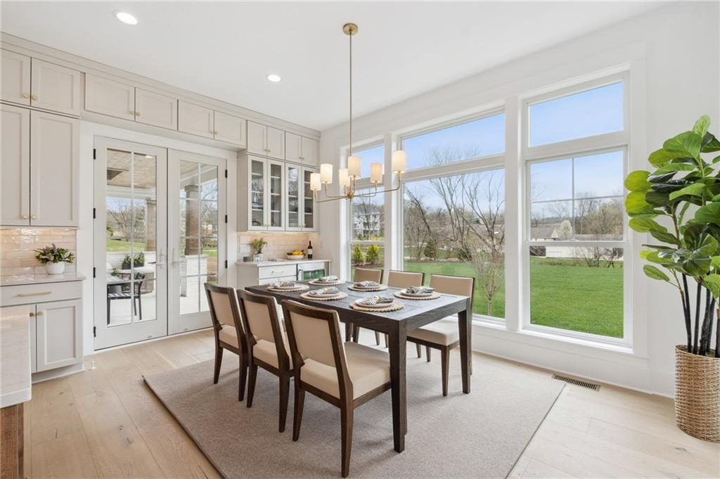 205 Rothaar Court Venetia, PA 15367 - Photo 13 of 35 a dining room with furniture a chandelier and wooden floor