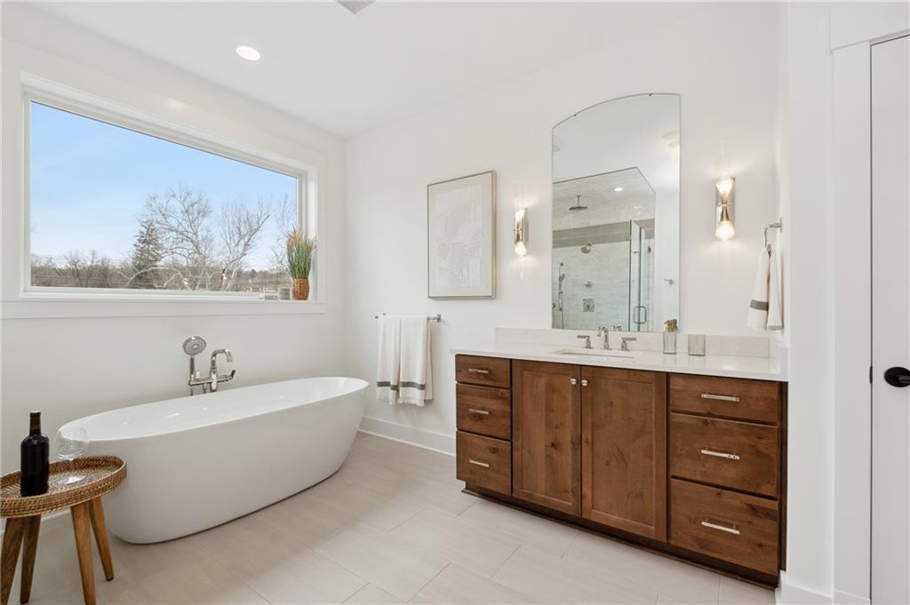 205 Rothaar Court Venetia, PA 15367 - Photo 19 of 35 a spacious bathroom with a double vanity sink mirror and bathtub