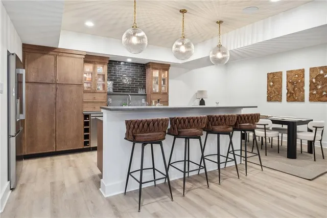a large kitchen with a table and chairs in it