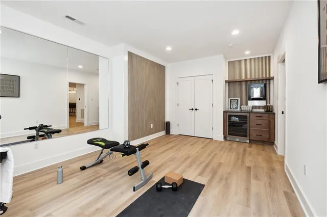 a view of a room with gym equipment and equipment