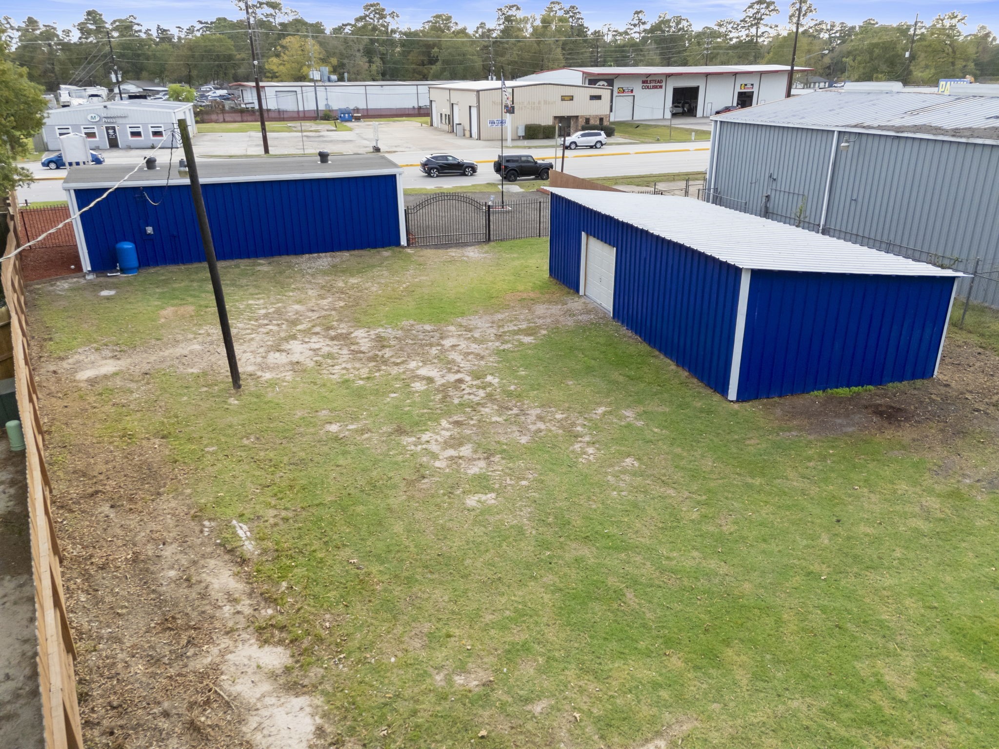 1635 Rayford Road Spring, TX 77386 - Photo 5 of 50 Recent vibrant paint, new roof on front building, upgraded front fencing and landscaping is all ready for your business venture!