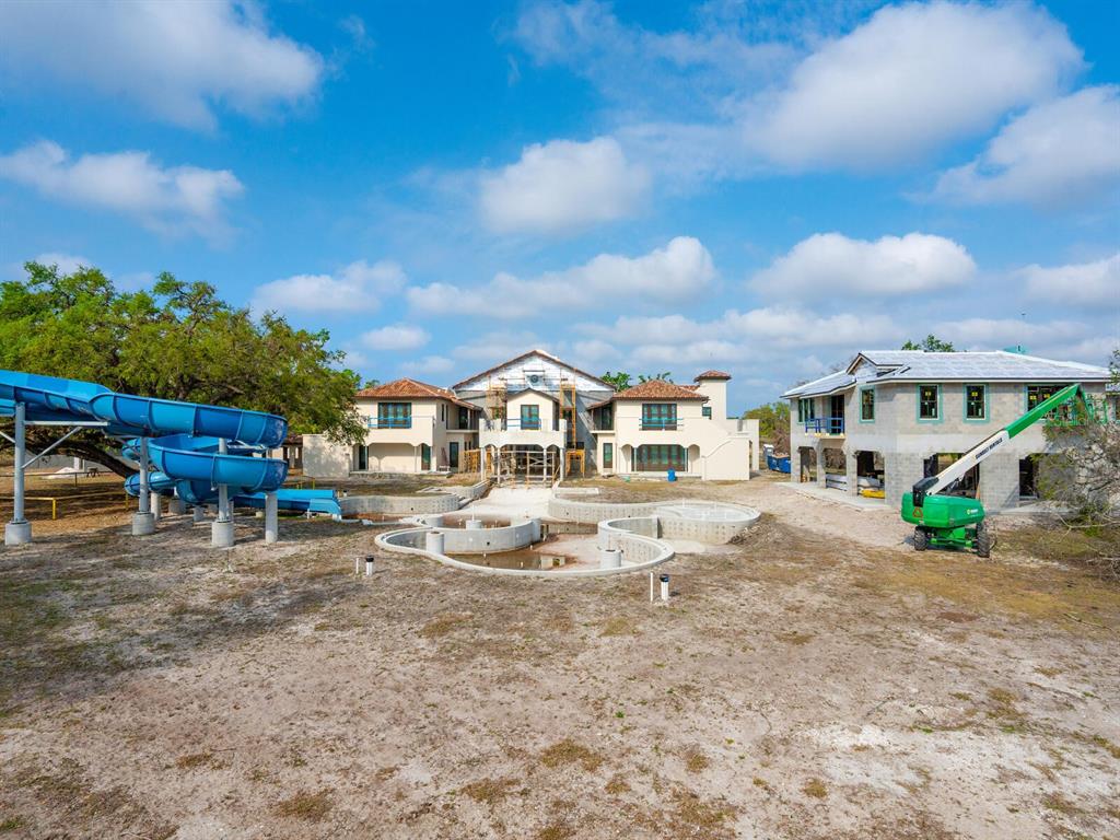 600 North Jackson Road Venice, FL 34292 - Photo 26 of 61 a view of a house with swimming pool and sitting area