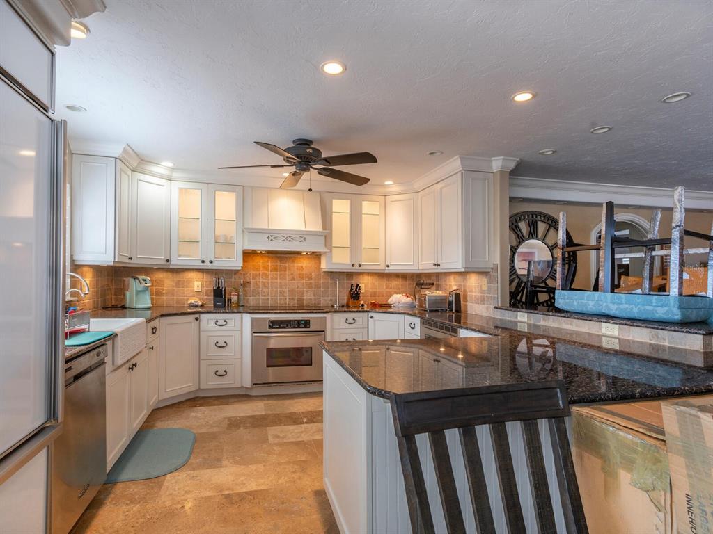 600 North Jackson Road Venice, FL 34292 - Photo 27 of 61 a kitchen with lots of counter top space and appliances