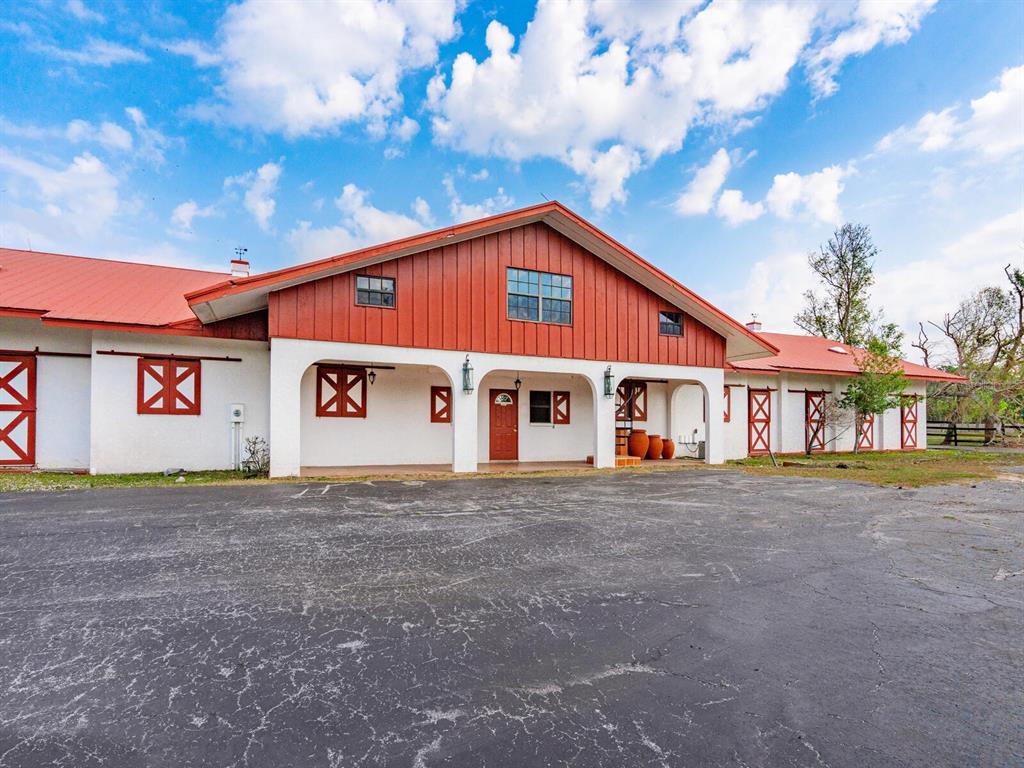 600 North Jackson Road Venice, FL 34292 - Photo 32 of 61 a front view of a house with a yard and garage