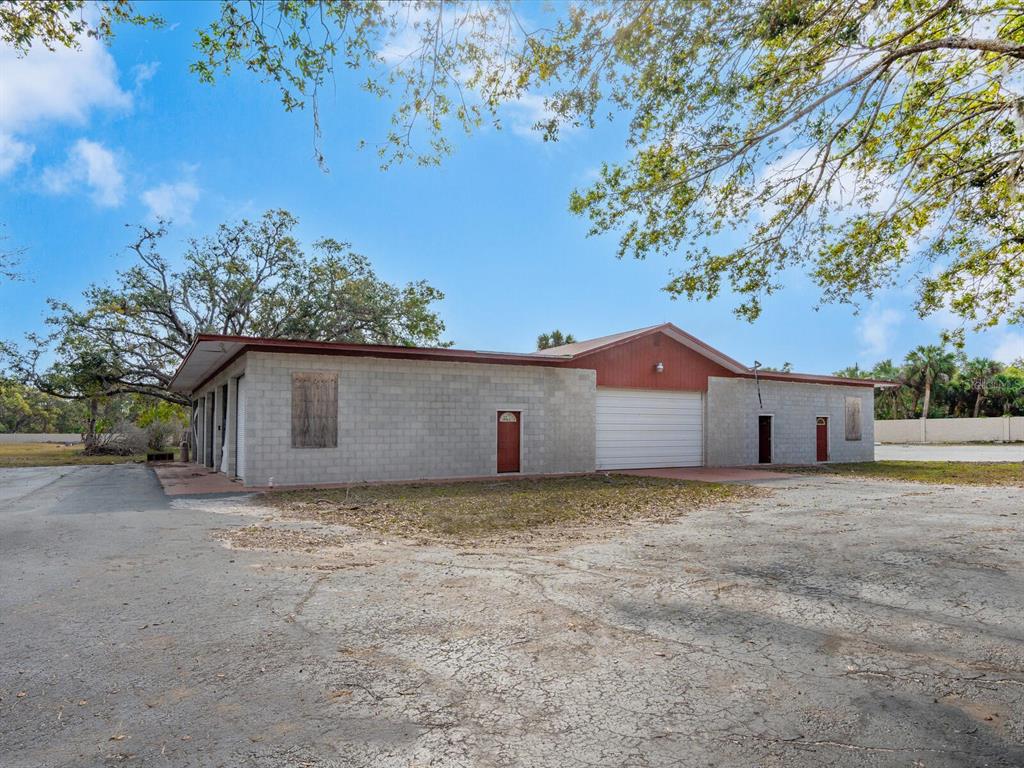 600 North Jackson Road Venice, FL 34292 - Photo 40 of 61 a view of a house with a yard