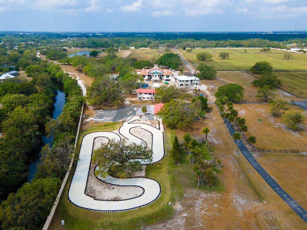 600 North Jackson Road Venice, FL 34292 - Photo 47 of 61 a view of a lake with a swimming pool