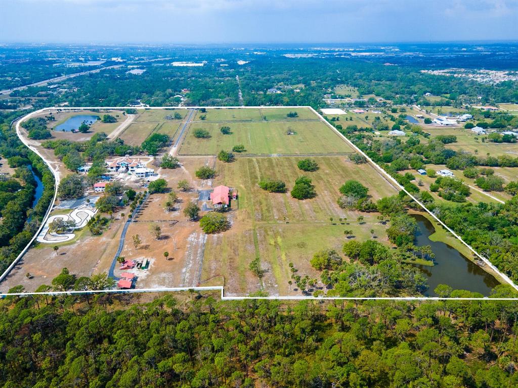 600 North Jackson Road Venice, FL 34292 - Photo 61 of 61 an aerial view of residential houses with outdoor space and trees