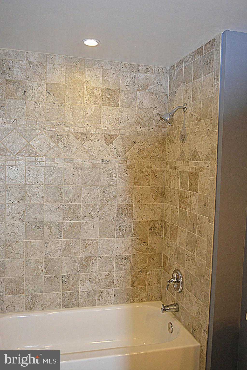 622 Hornbeam Road Edgewood, MD 21040 - Photo 11 of 19 a bathroom with a bathtub and a shower