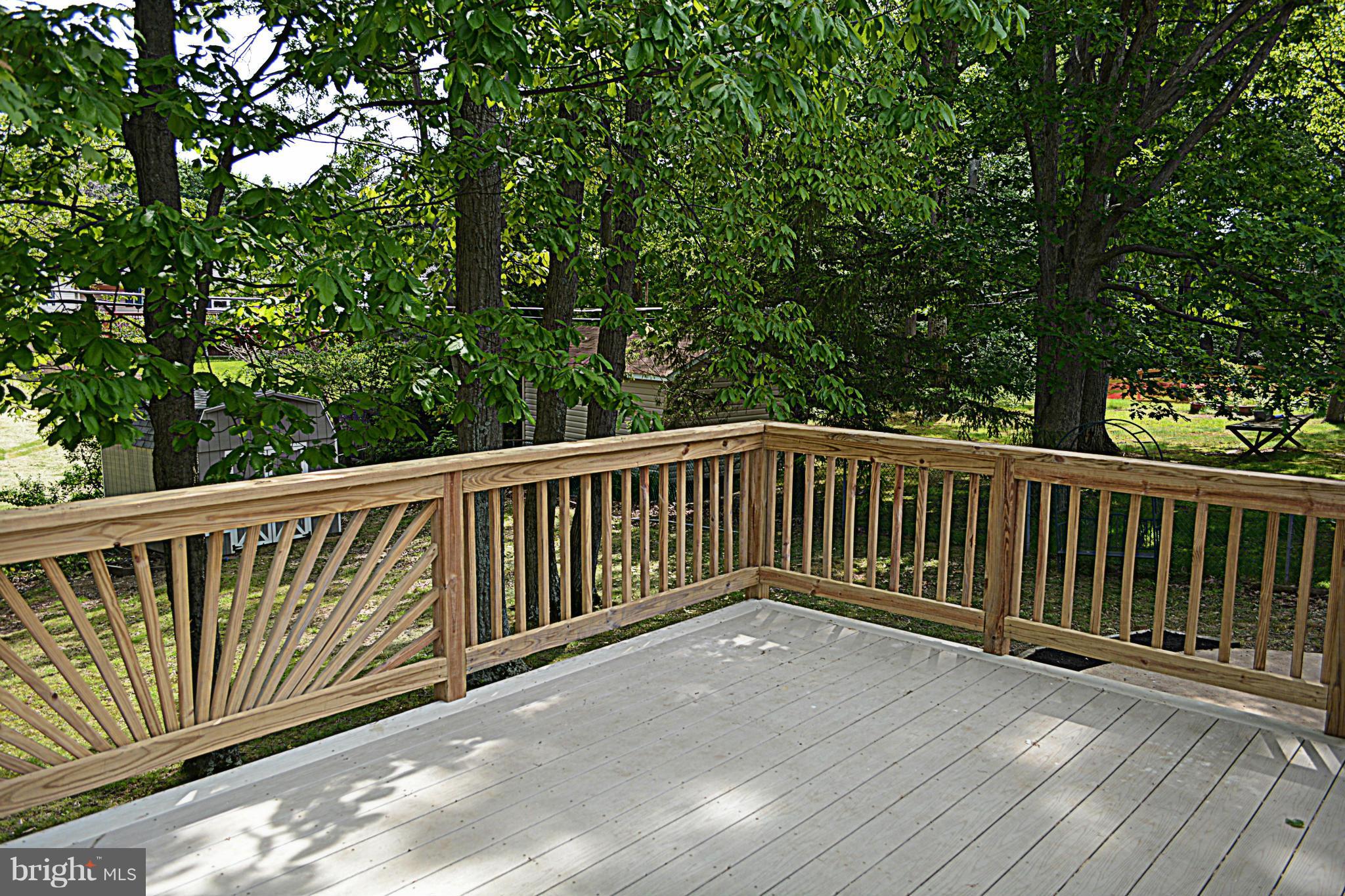 622 Hornbeam Road Edgewood, MD 21040 - Photo 18 of 19 a balcony with wooden floor and trees in the back