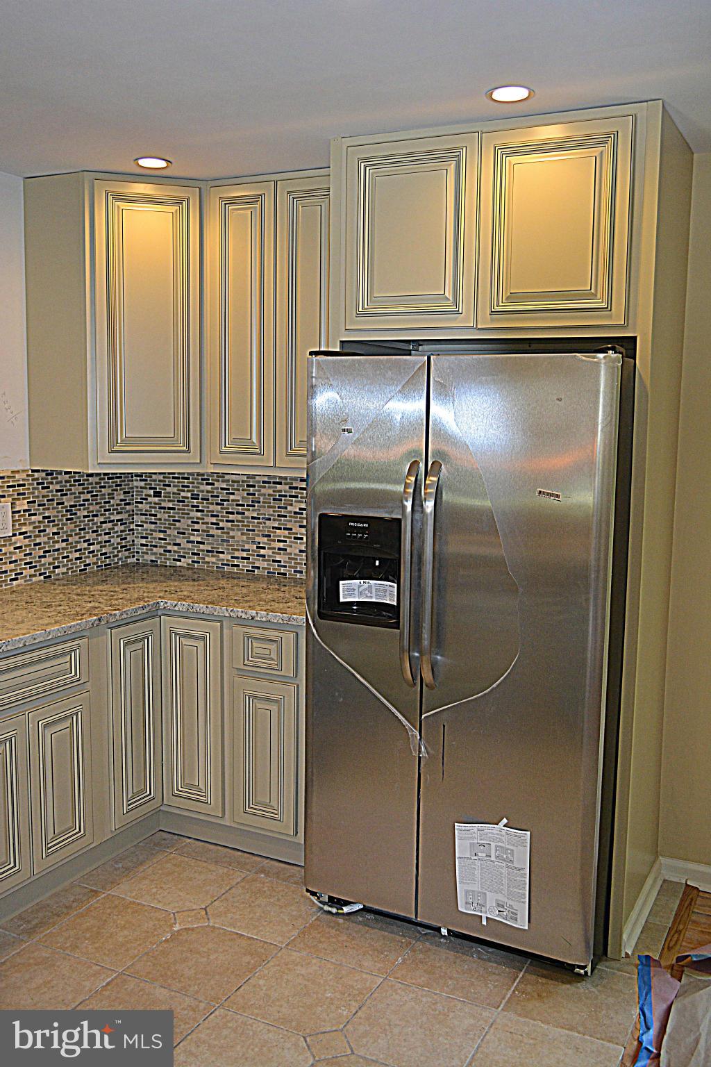 622 Hornbeam Road Edgewood, MD 21040 - Photo 4 of 19 a kitchen with a refrigerator and cabinets