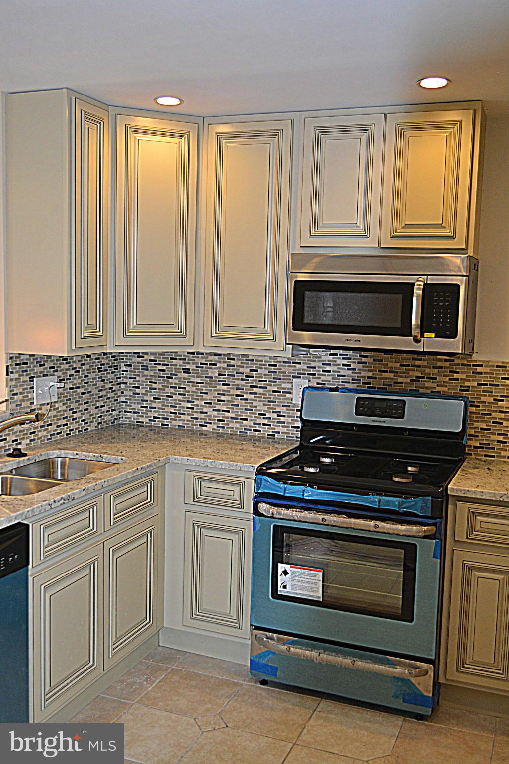 622 Hornbeam Road Edgewood, MD 21040 - Photo 5 of 19 a kitchen with wooden cabinets and stainless steel appliances