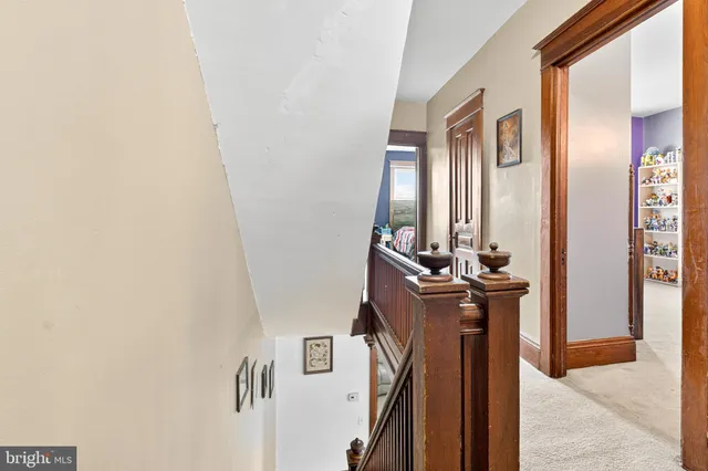 a bathroom with a sink mirror vanity and toilet