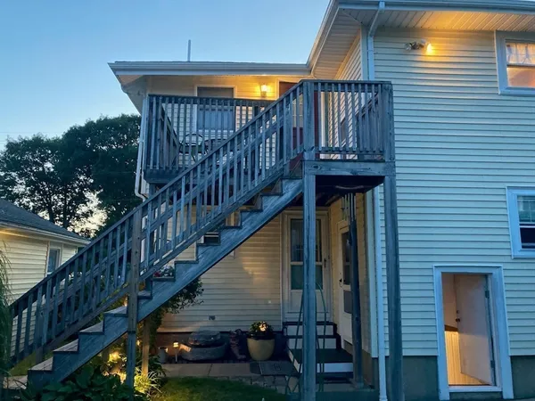 a view of balcony with wooden stairs and stairs