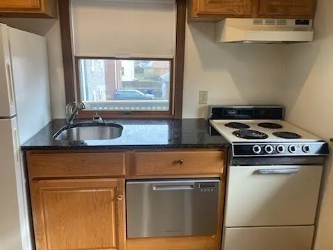 a kitchen with a stove and a sink