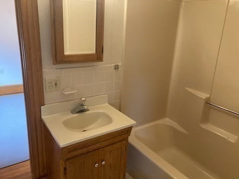 93 Russell Street, Unit A Quincy, MA 02171 - Photo 10 of 14 a bathroom with a sink and a bathtub