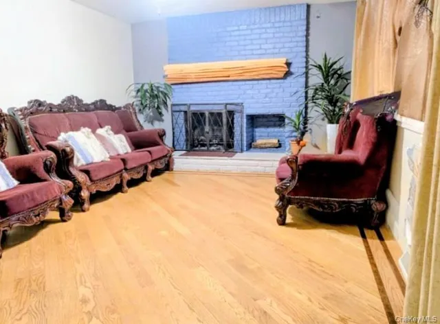 a building outdoor space with patio furniture and a fireplace