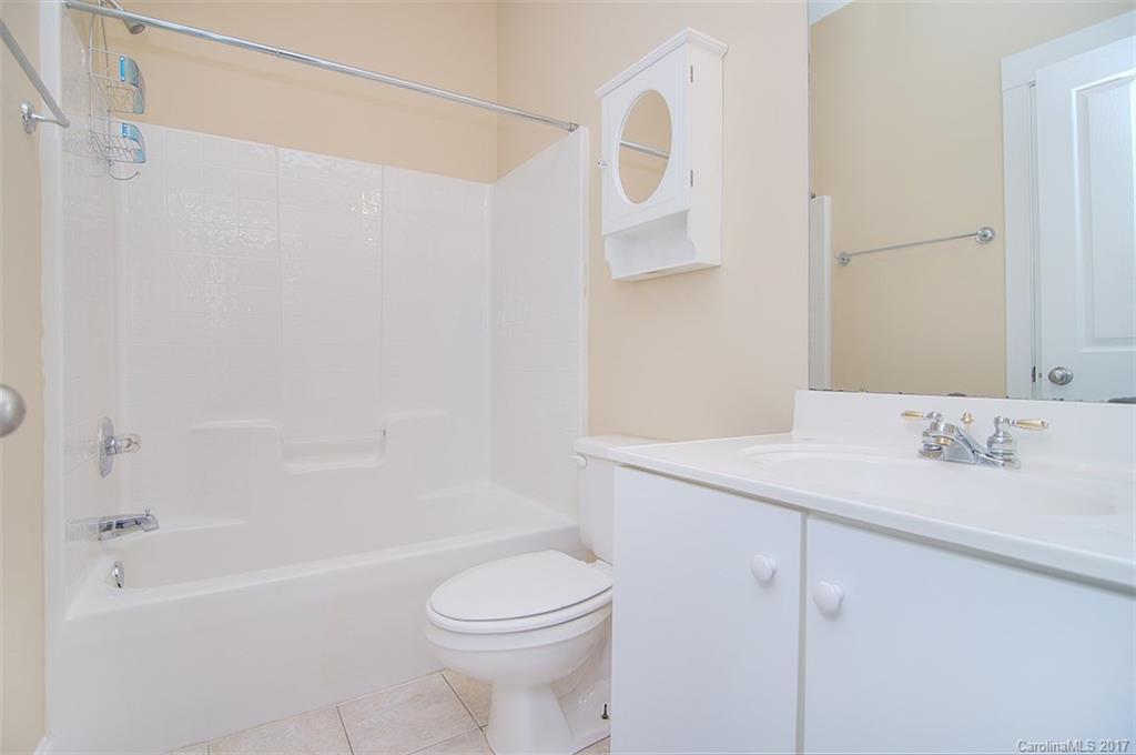 11326 Deer Ridge Lane Charlotte, NC 28277 - Photo 4 of 21 a bathroom with a sink a toilet and a bathtub