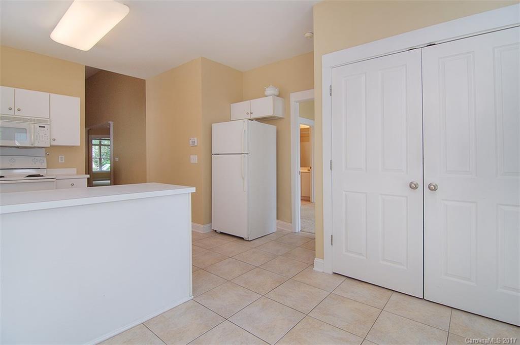 11326 Deer Ridge Lane Charlotte, NC 28277 - Photo 6 of 21 a utility room with cabinets washer and dryer