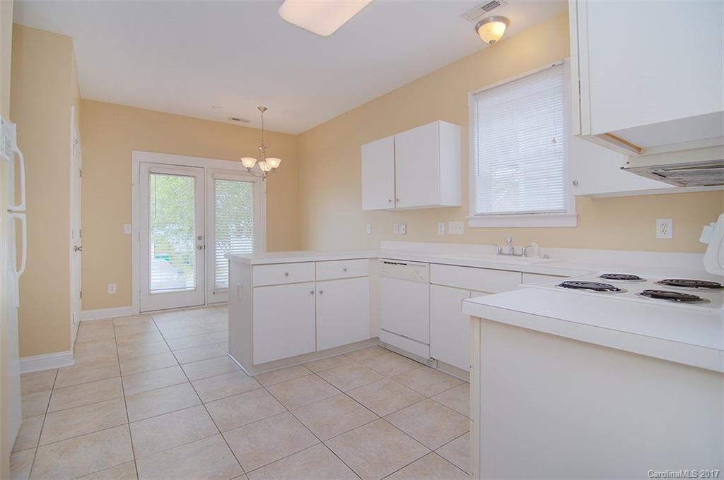 11326 Deer Ridge Lane Charlotte, NC 28277 - Photo 10 of 21 a kitchen with a stove a sink and a refrigerator