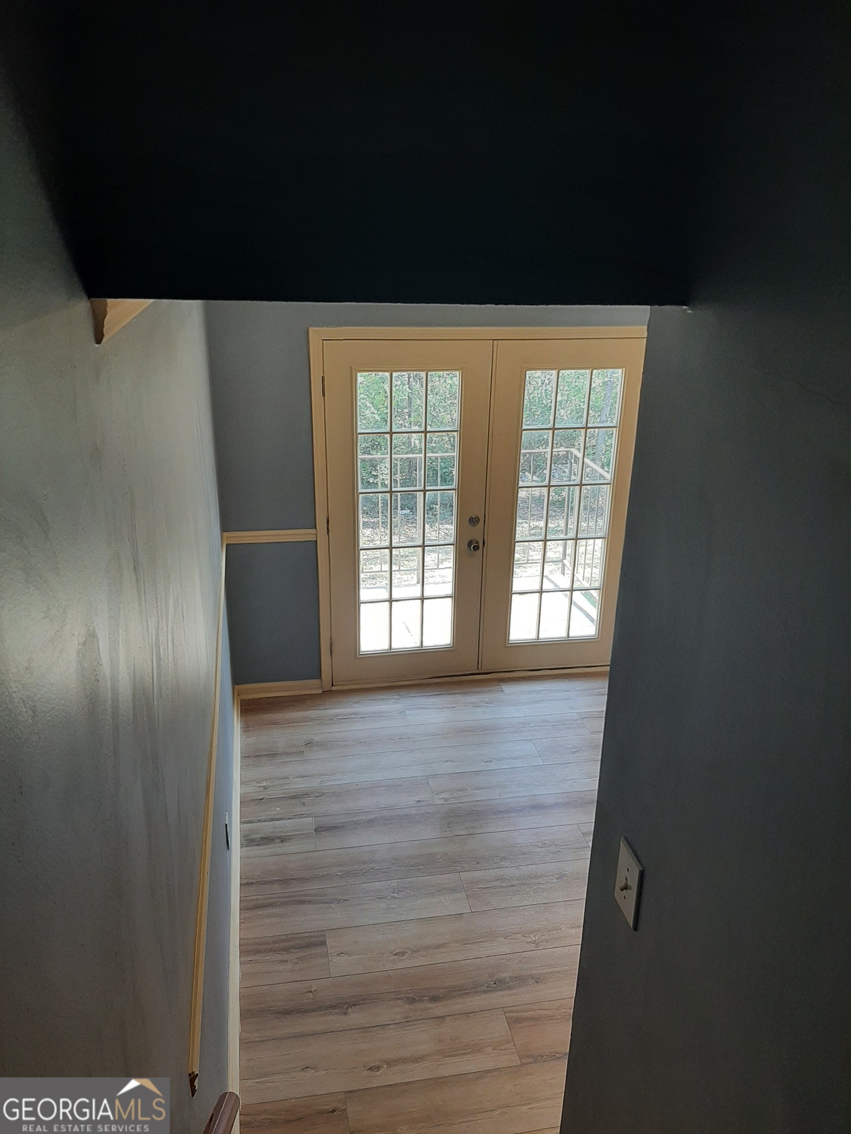 1625 Conley Road, Unit 171 Conley, GA 30288 - Photo 12 of 27 a view of an empty room with wooden floor and a window