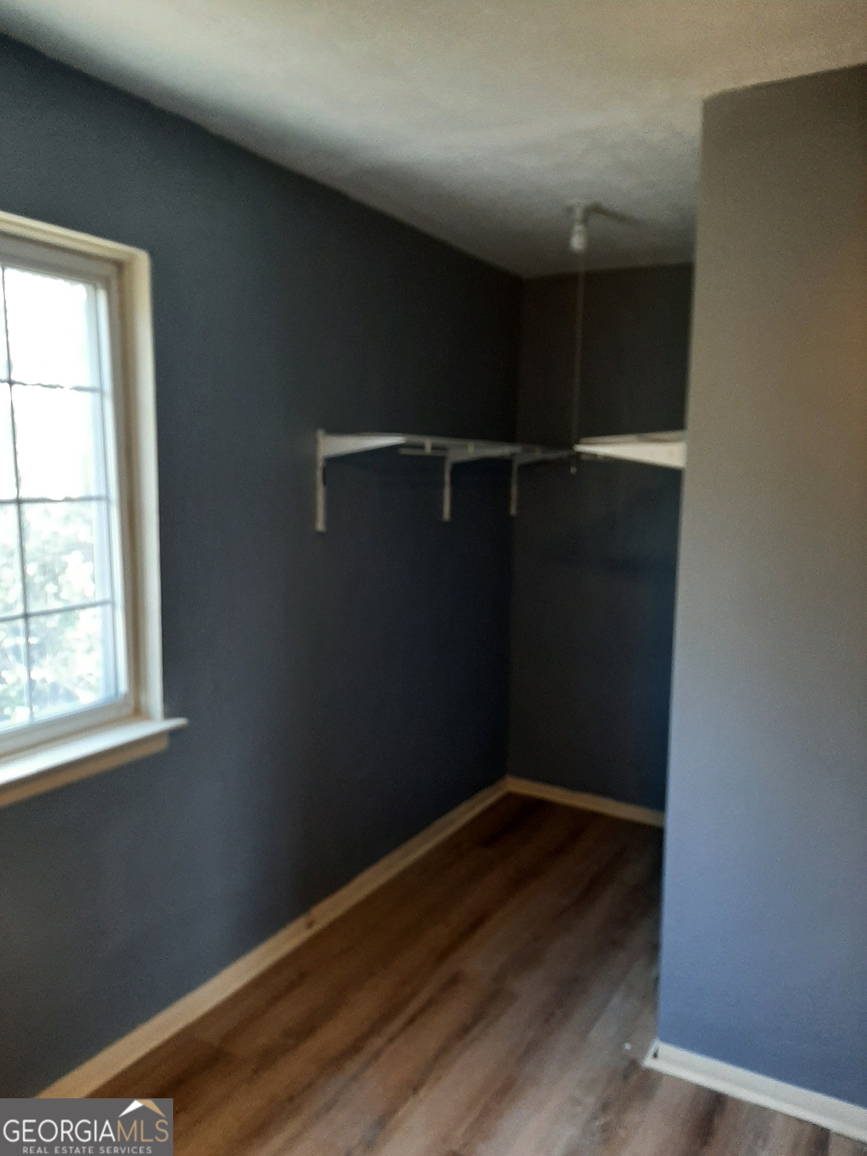 1625 Conley Road, Unit 171 Conley, GA 30288 - Photo 16 of 27 an empty room with wooden floor