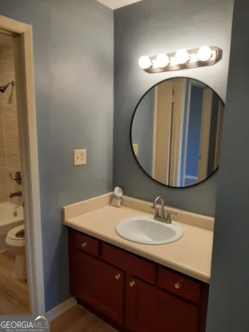 a bathroom with a sink and a mirror