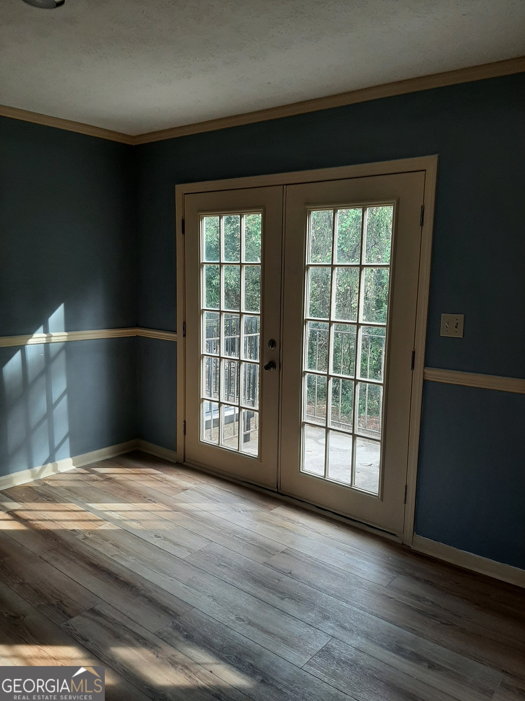 1625 Conley Road, Unit 171 Conley, GA 30288 - Photo 23 of 27 a view of an empty room with wooden floor and a window