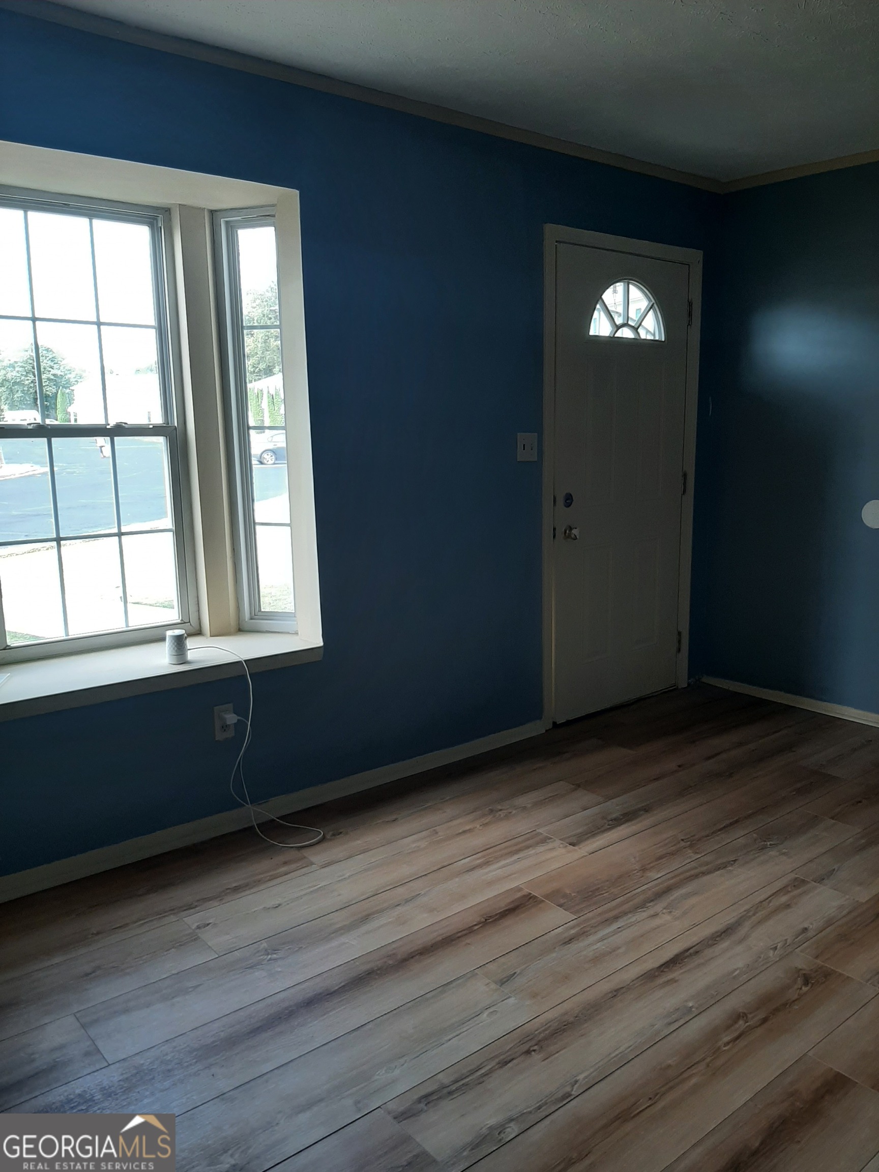 1625 Conley Road, Unit 171 Conley, GA 30288 - Photo 24 of 27 an empty room with wooden floor and windows