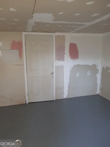 a view of a room with a hallway