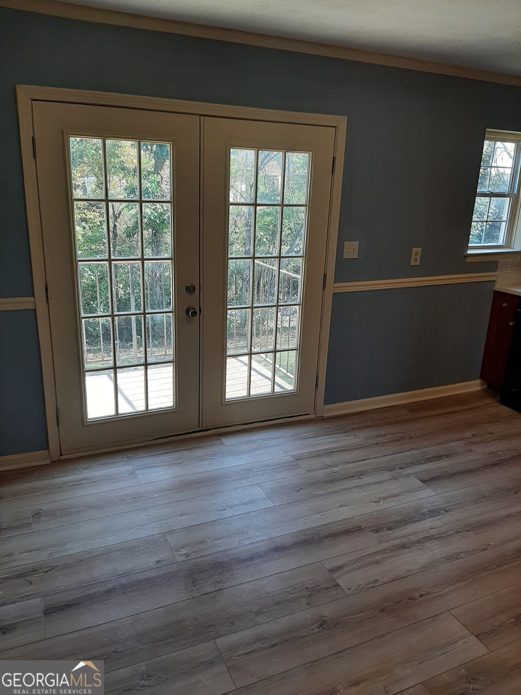 1625 Conley Road, Unit 171 Conley, GA 30288 - Photo 10 of 27 a view of an empty room with wooden floor and a window