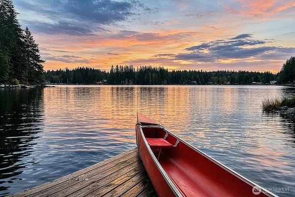 a view of sitting space next to a lake