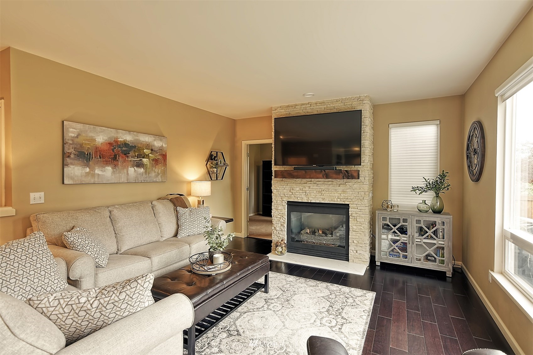 20027 29th Avenue Southeast Bothell, WA 98012 - Photo 15 of 38 a living room with furniture a flat screen tv and a fireplace