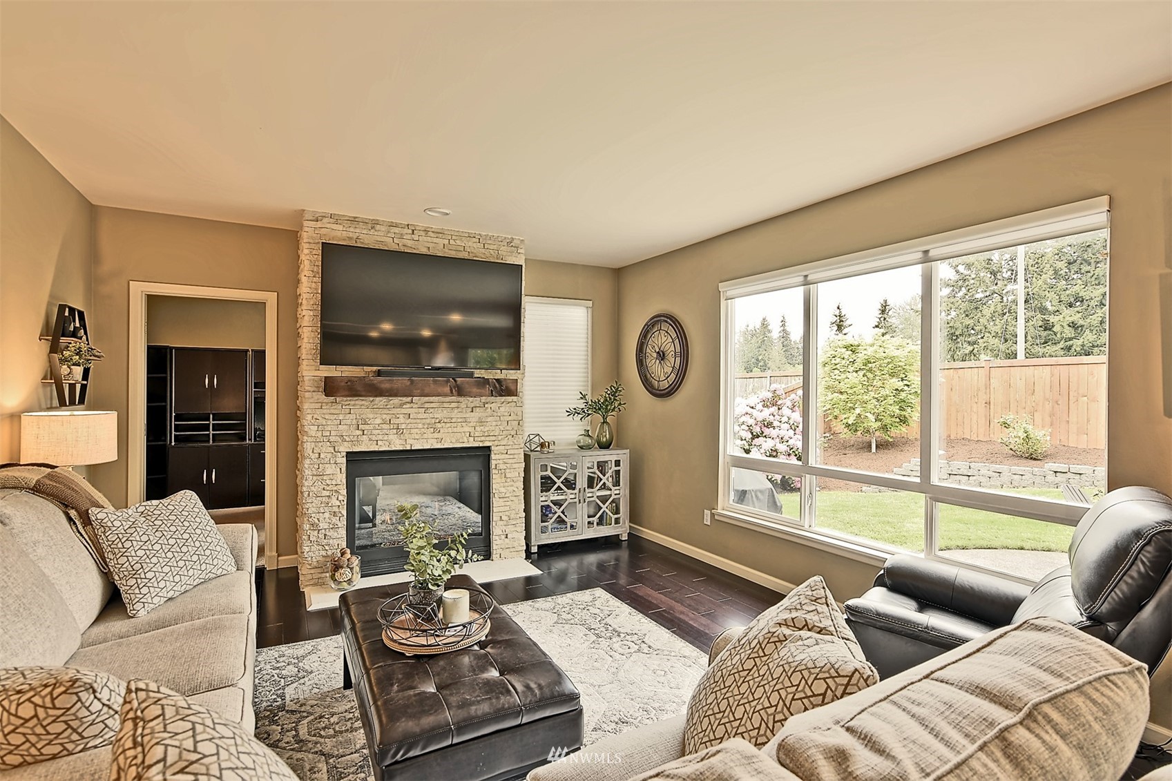 20027 29th Avenue Southeast Bothell, WA 98012 - Photo 16 of 38 a living room with furniture fireplace and window