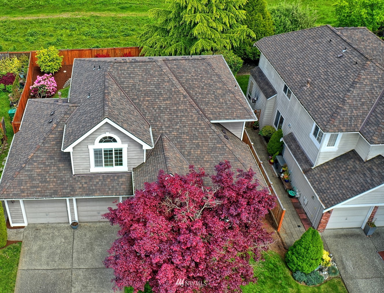 20027 29th Avenue Southeast Bothell, WA 98012 - Photo 2 of 38 an aerial view of a house with a yard