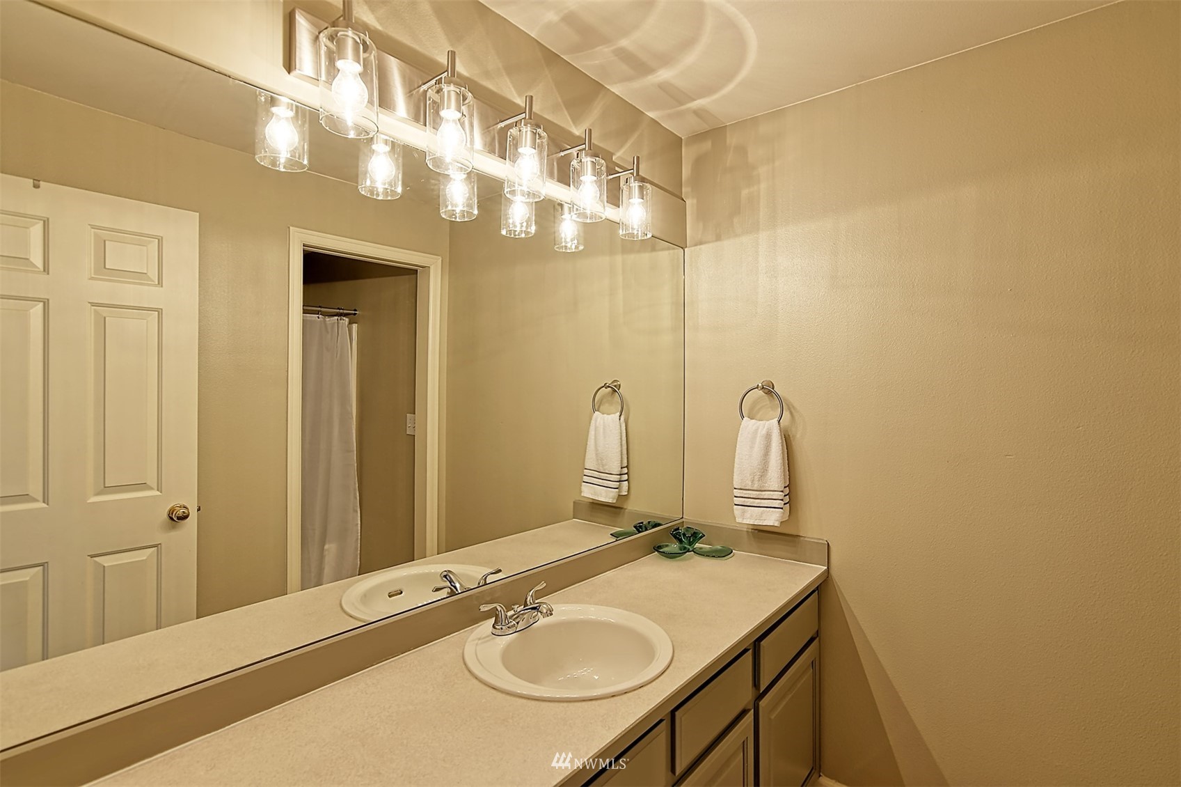 20027 29th Avenue Southeast Bothell, WA 98012 - Photo 23 of 38 a bathroom with a sink and a mirror