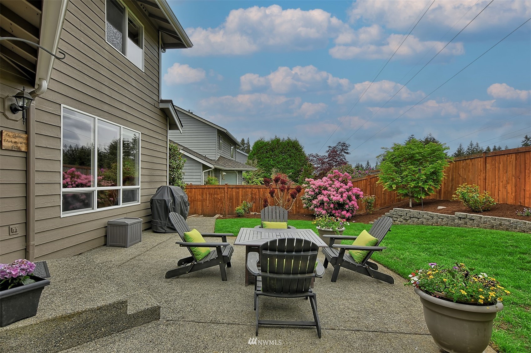20027 29th Avenue Southeast Bothell, WA 98012 - Photo 37 of 38 a view of a chair and table in backyard of the house