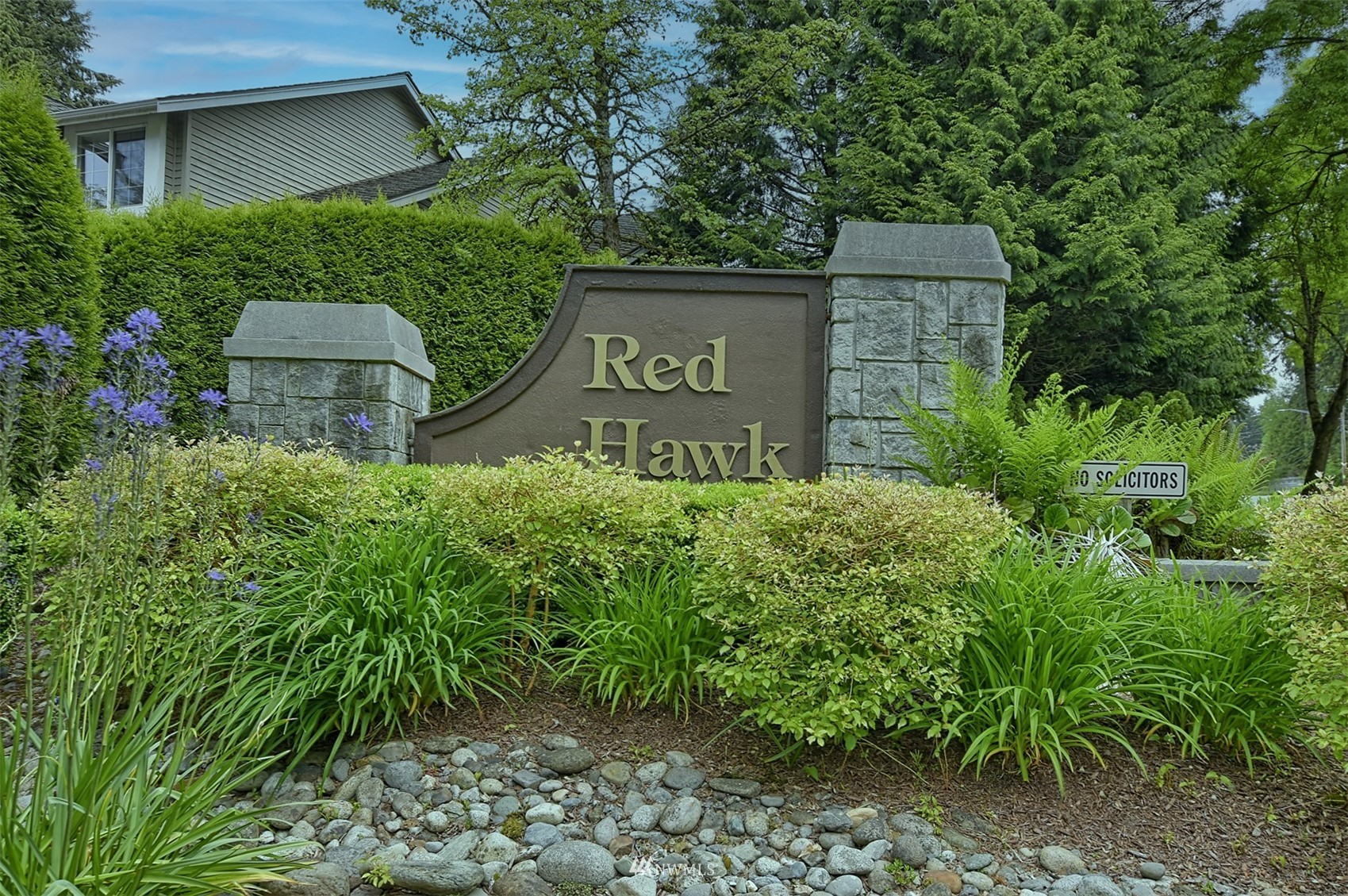 20027 29th Avenue Southeast Bothell, WA 98012 - Photo 38 of 38 a sign that is sitting in front of a bunch of plants