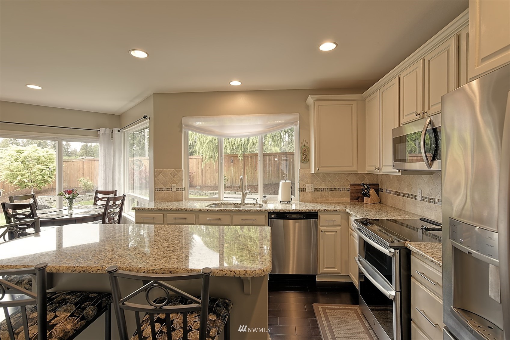 20027 29th Avenue Southeast Bothell, WA 98012 - Photo 10 of 38 a kitchen with lots of counter top space and stainless steel appliances