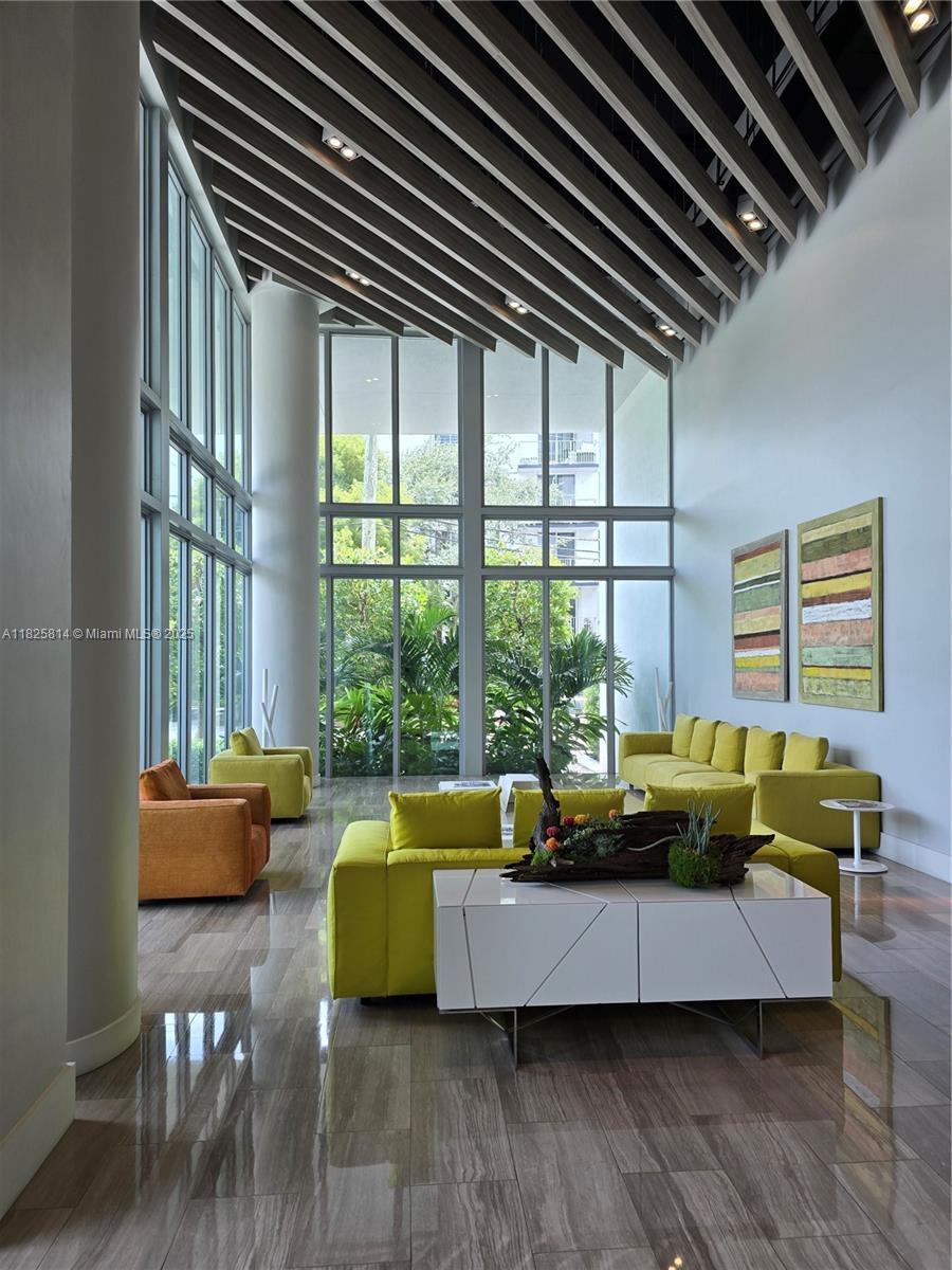 1600 Southwest 1st Avenue, Unit 809 Miami, FL 33129 - Photo 16 of 24 a living room with furniture and a large window