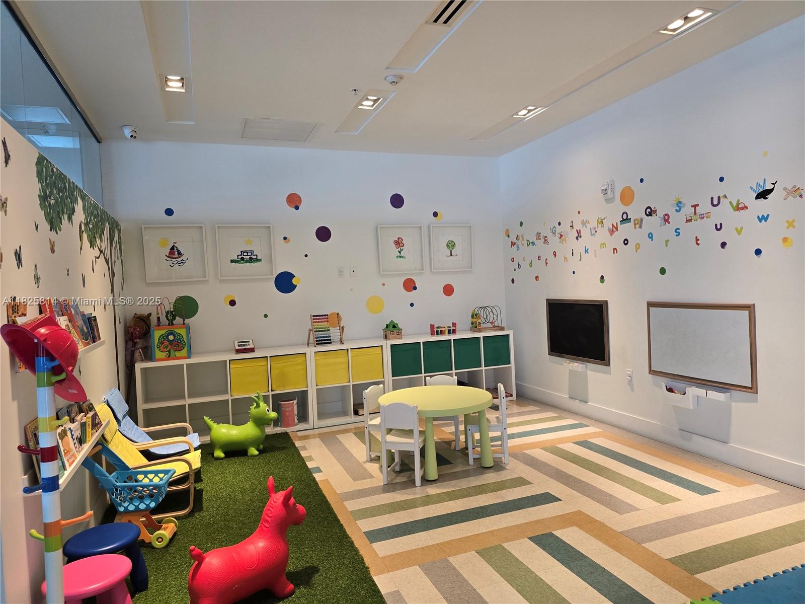 1600 Southwest 1st Avenue, Unit 809 Miami, FL 33129 - Photo 19 of 24 a living room with furniture and a flat screen tv